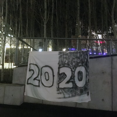 A spray painted 2020 banner hangs outside of the Harbourfront Centre, Queens Quay, Toronto, Canada.